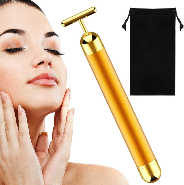 Gold facial roller with a black pouch on a white background